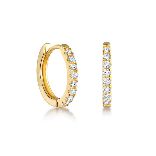 Photo of huggie earrings with cubic zirconia pave detailing. made from sterling silver plated with 18k 1-micron gold